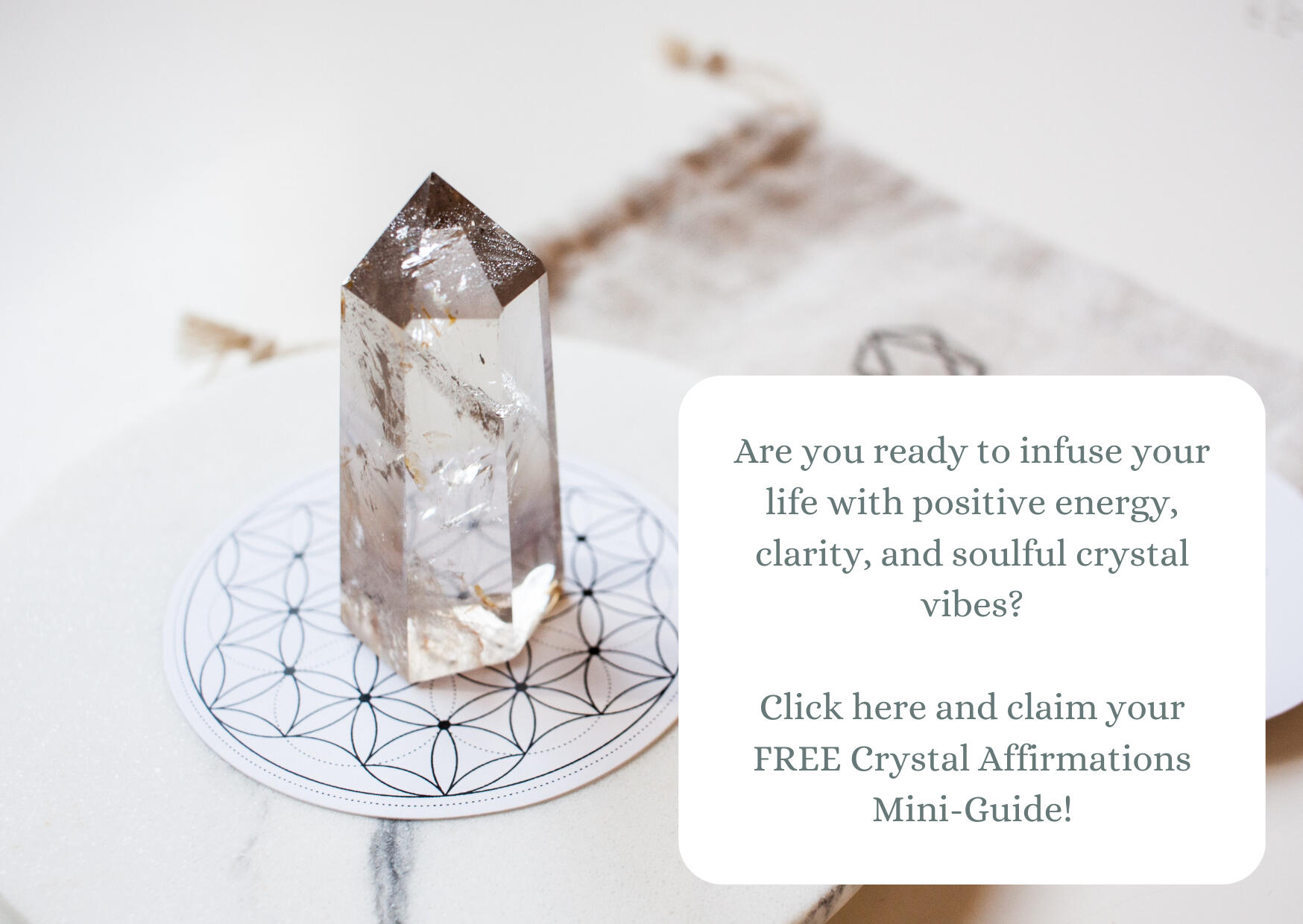 Clear Quartz crystal point with link to claim a free crystal affirmations mini guide